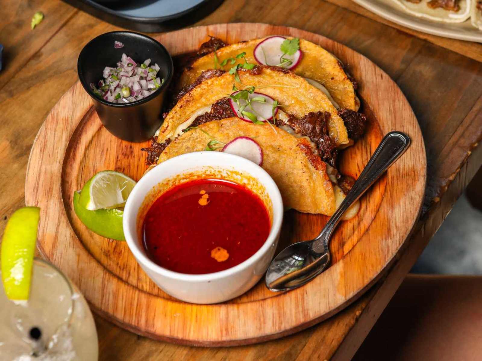 Mercadito quesabirria tacos with consomme and margarita